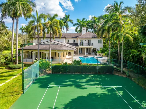 a view of a house with swimming pool