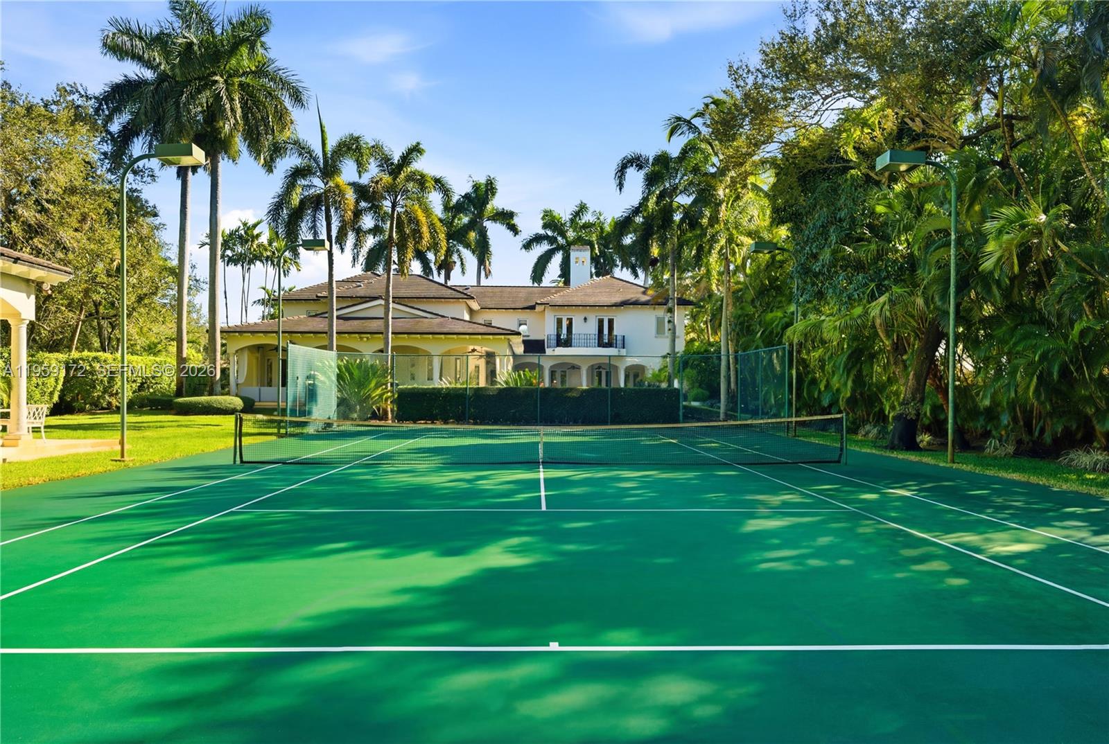 8400 School House Road Miami, FL 33143 - Photo 65 of 66 a view of a white house in a big yard with palm trees
