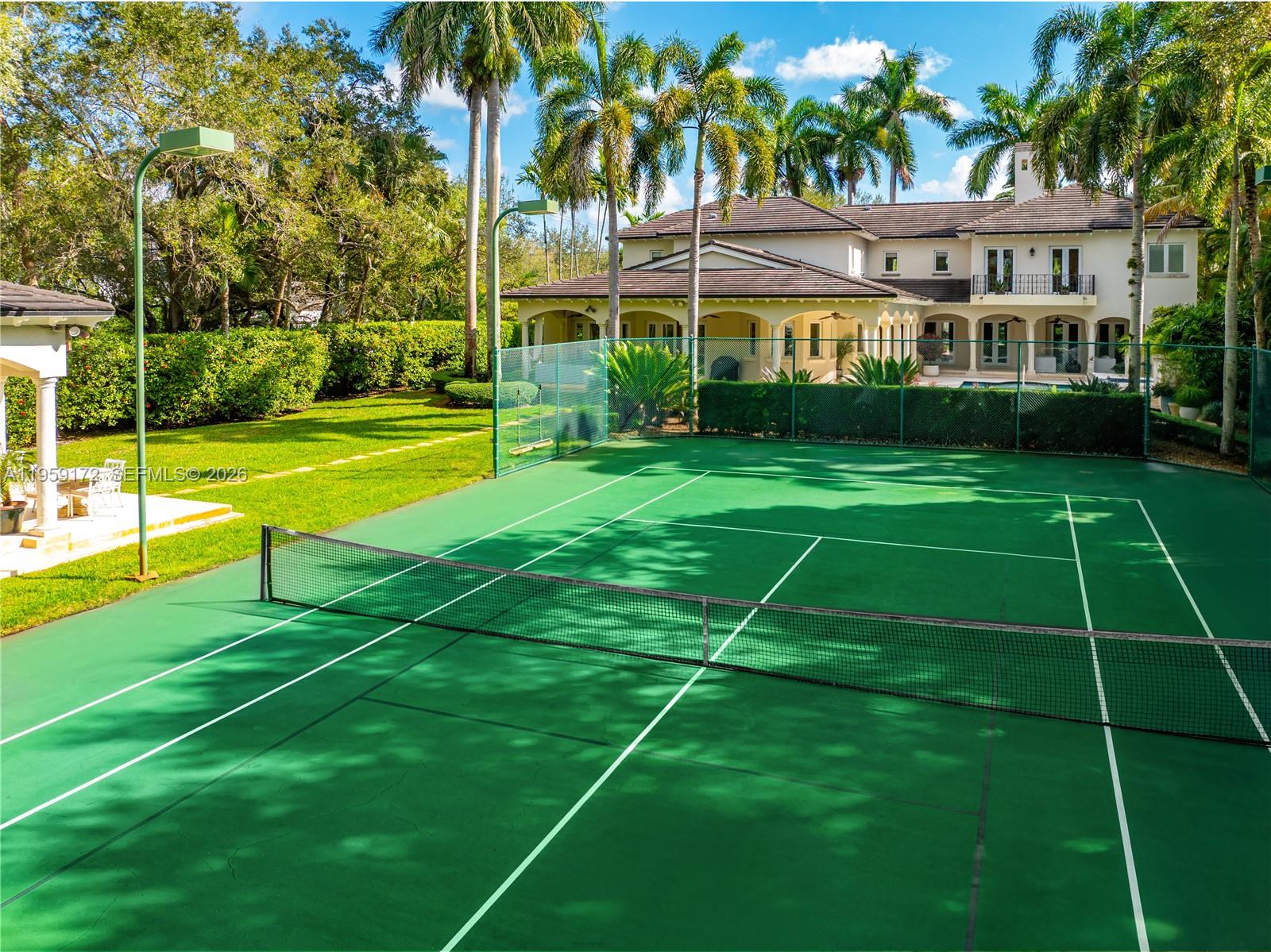 8400 School House Road Miami, FL 33143 - Photo 7 of 66 a view of an house with a big yard and palm trees