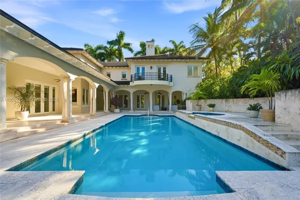 a front view of a house with swimming pool