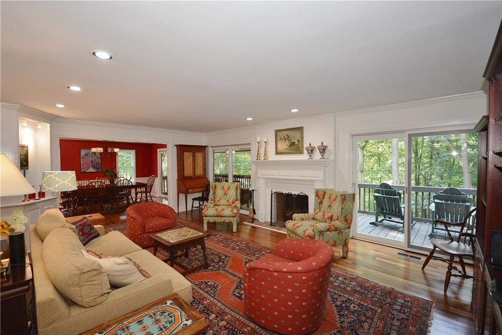 301 Wildberry Road Pittsburgh, PA 15238 - Photo 11 of 24 View of the living room with log-burning fireplace, beautiful floors, recessed lighting, builtins, access to wet bar and patio doors to deck and screen-porch.