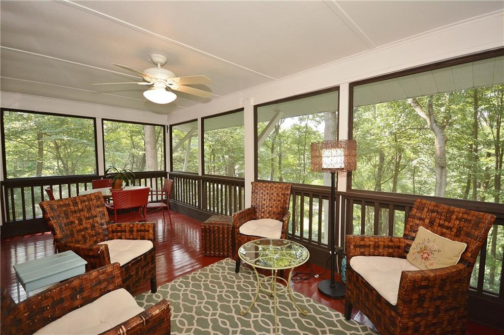 301 Wildberry Road Pittsburgh, PA 15238 - Photo 4 of 24 Fantastic screened-in porch adjacent to the living/dining area with ceiling fan, outside door to deck and panoramic, private,serene views in rear.