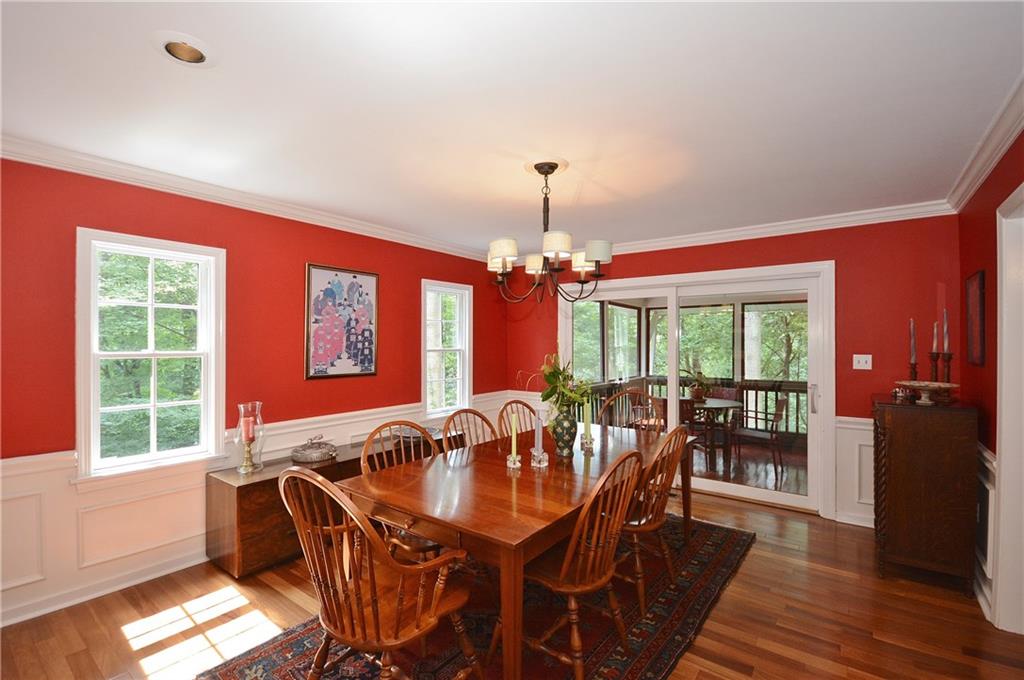 301 Wildberry Road Pittsburgh, PA 15238 - Photo 10 of 24 Dining room with attractive moldings, gorgeous floors, plenty of doors to access living areas and screened-in porch making great flow and a friendly floor plan for entertaining family/guests.