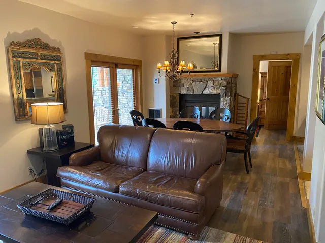 a living room with furniture fireplace and flat screen tv