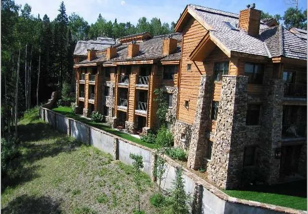a view of house with outdoor space and sitting area