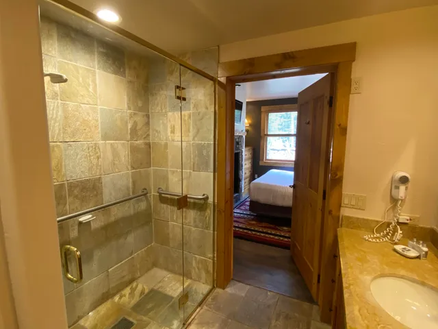 a en suite bathroom with a sink and a shower