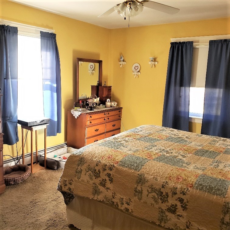 645 Knotty Oak Road Coventry, RI 02816 - Photo 20 of 35 1st floor bedroom has hardwood floors under carpets