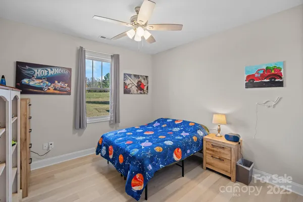 a bathroom with a toilet a sink and a mirror