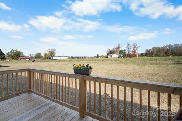 a view of a deck with a yard
