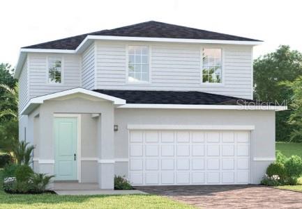 14421 Maiden Terrace Lakewood Ranch, FL 34211 - Photo 1 of 1 a front view of a house with a yard and garage
