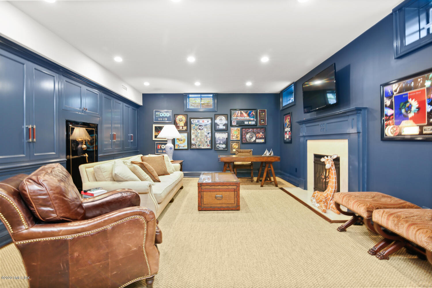 7 Finney Knoll Riverside, CT 06878 - Photo 20 of 30 a living room with furniture and a flat screen tv