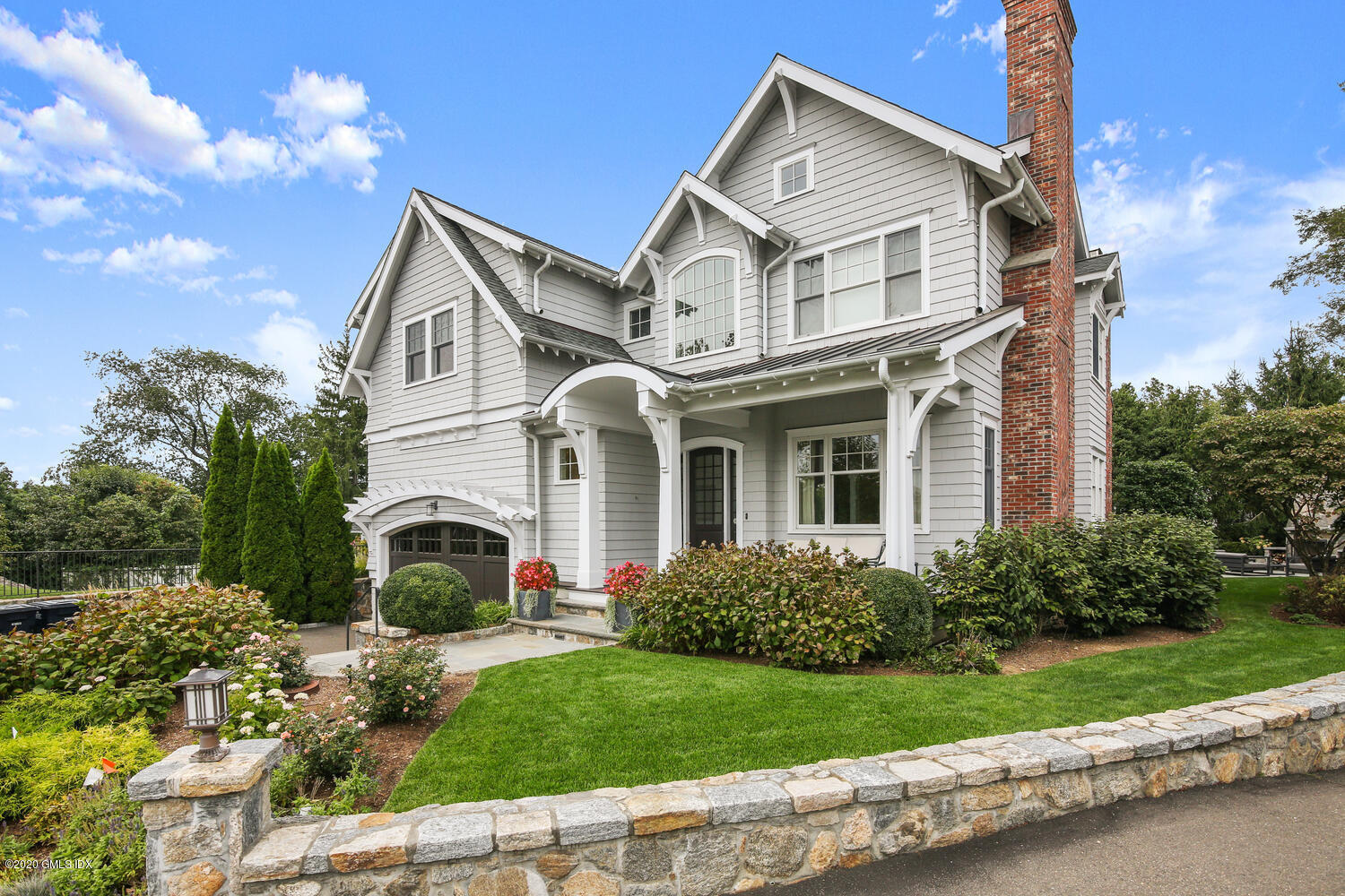 7 Finney Knoll Riverside, CT 06878 - Photo 26 of 30 a view of a white house with a big yard and potted plants