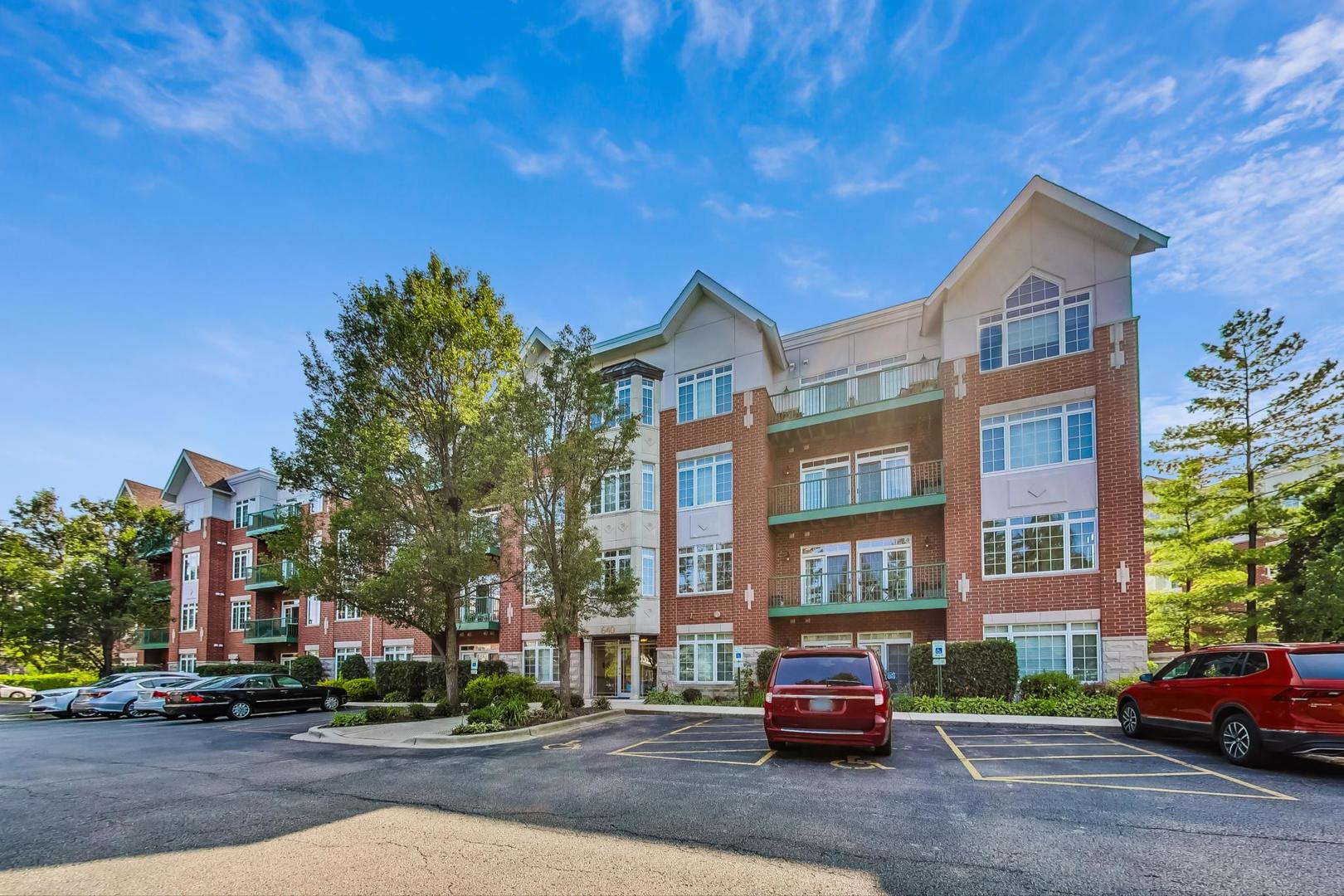640 McHenry Road, Unit 203 Wheeling, IL 60090 - Photo 3 of 41 a car parked on the side of a street