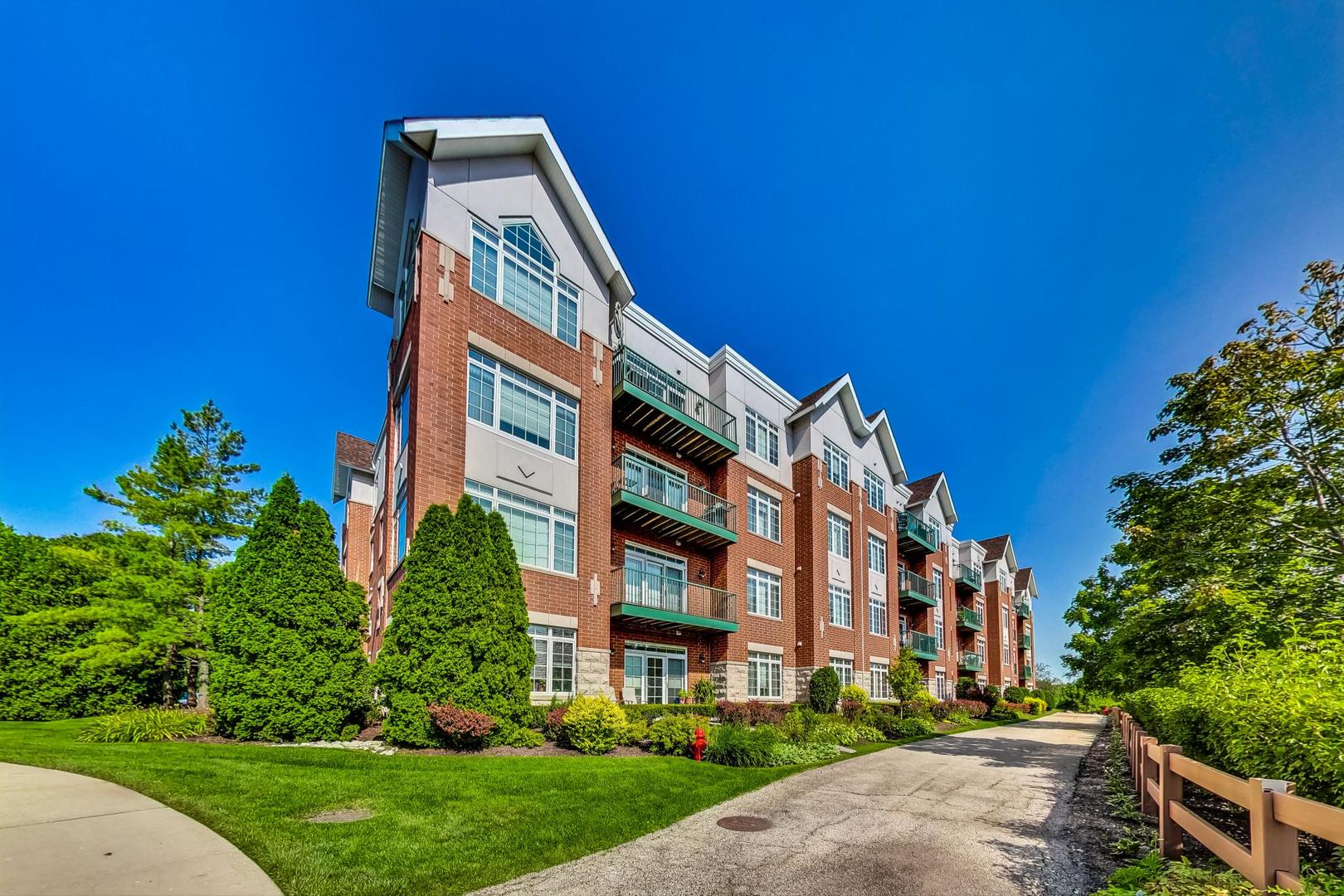 640 McHenry Road, Unit 203 Wheeling, IL 60090 - Photo 33 of 41 a front view of a building