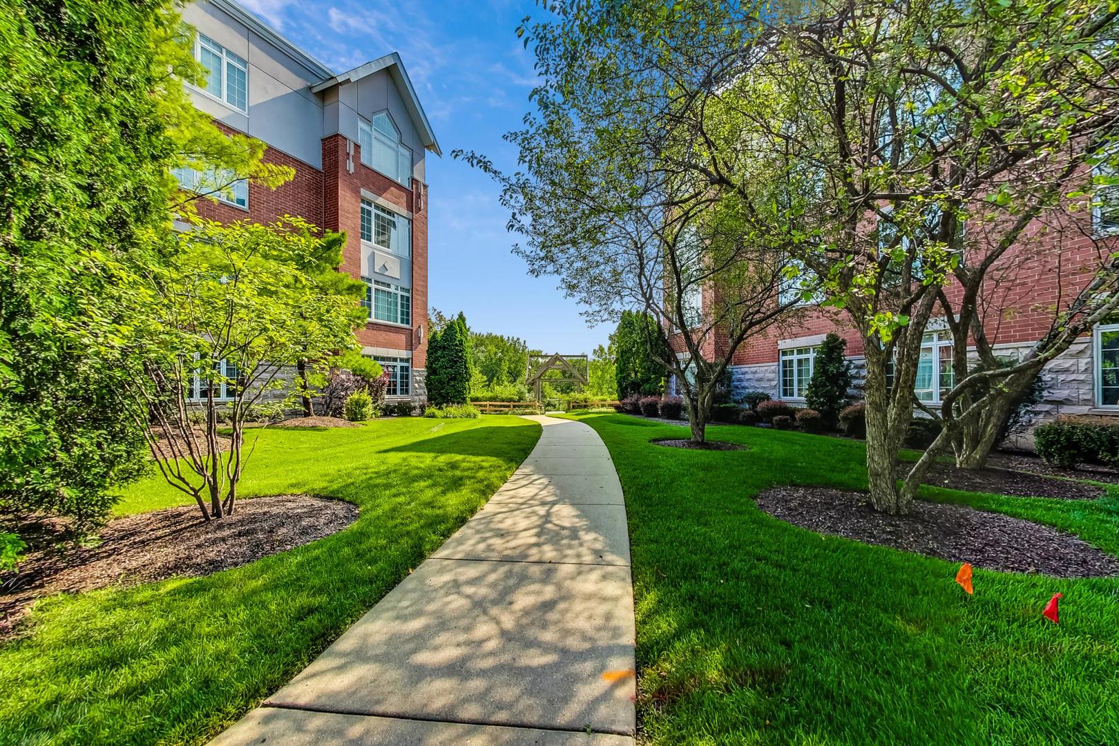 640 McHenry Road, Unit 203 Wheeling, IL 60090 - Photo 34 of 41 a view of a park with large trees