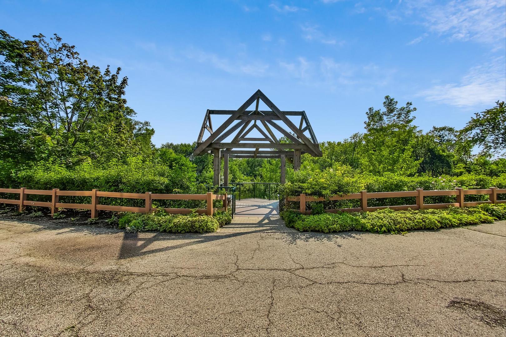 640 McHenry Road, Unit 203 Wheeling, IL 60090 - Photo 35 of 41 a front view of a house with a yard