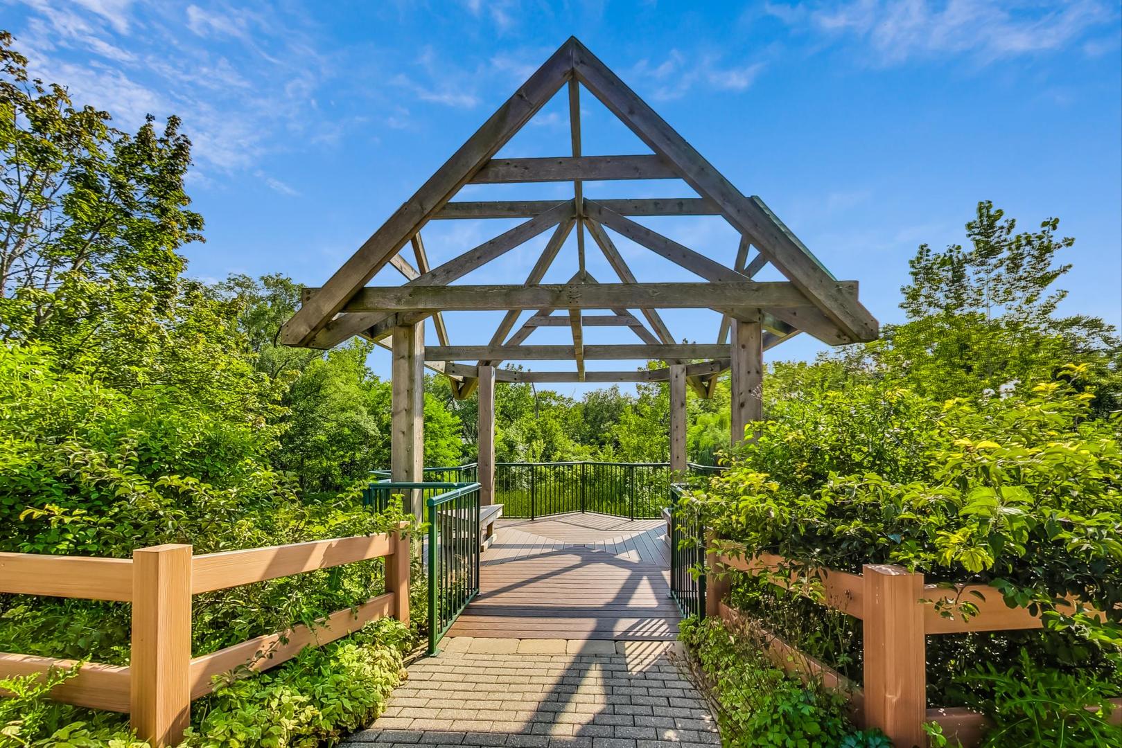 640 McHenry Road, Unit 203 Wheeling, IL 60090 - Photo 36 of 41 a front view of a house with a yard