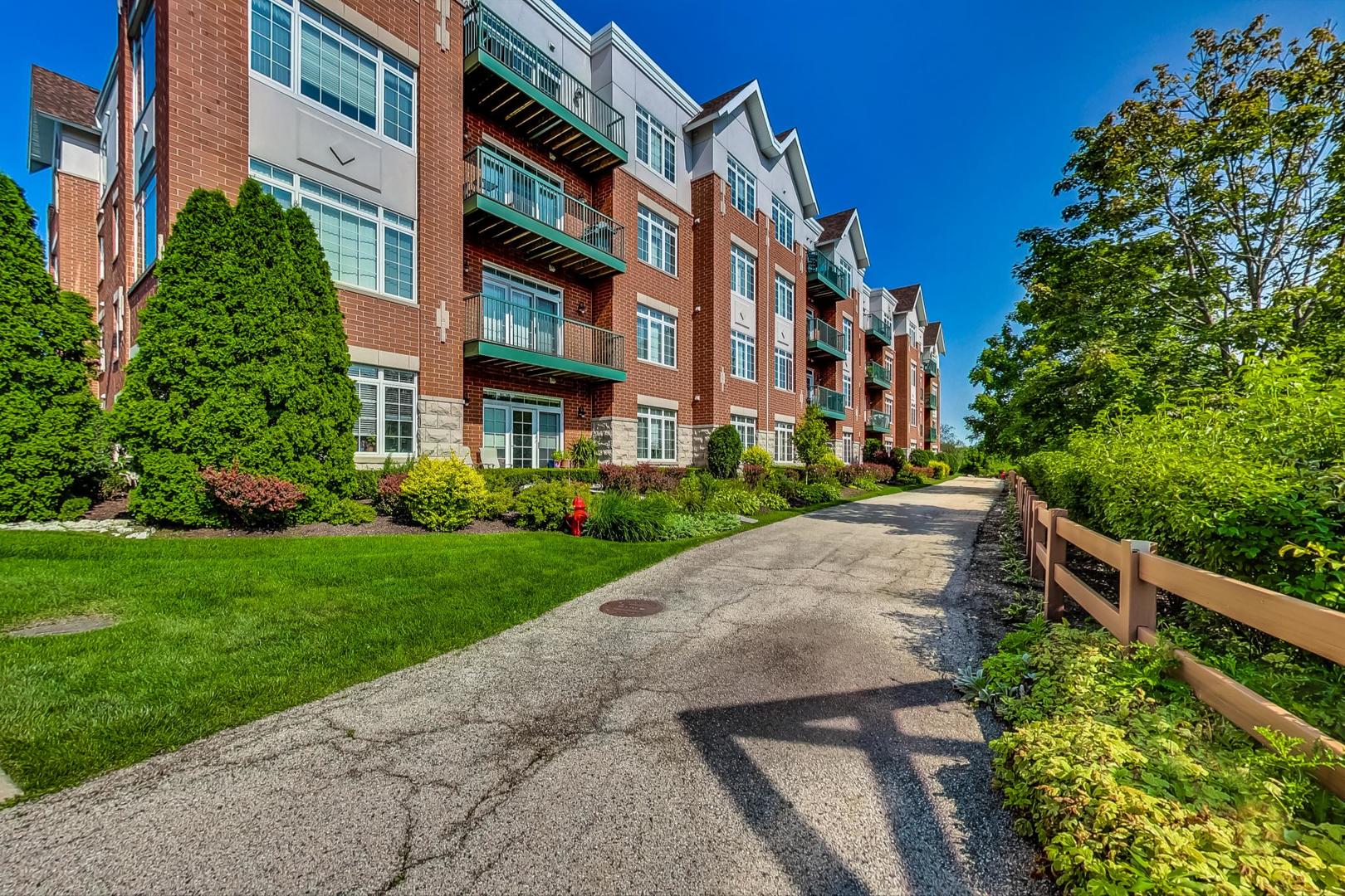 640 McHenry Road, Unit 203 Wheeling, IL 60090 - Photo 37 of 41 a view of a building with a yard