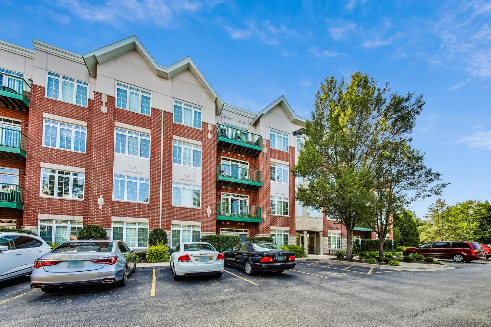640 McHenry Road, Unit 203 Wheeling, IL 60090 - Photo 4 of 41 a car parked in front of a building