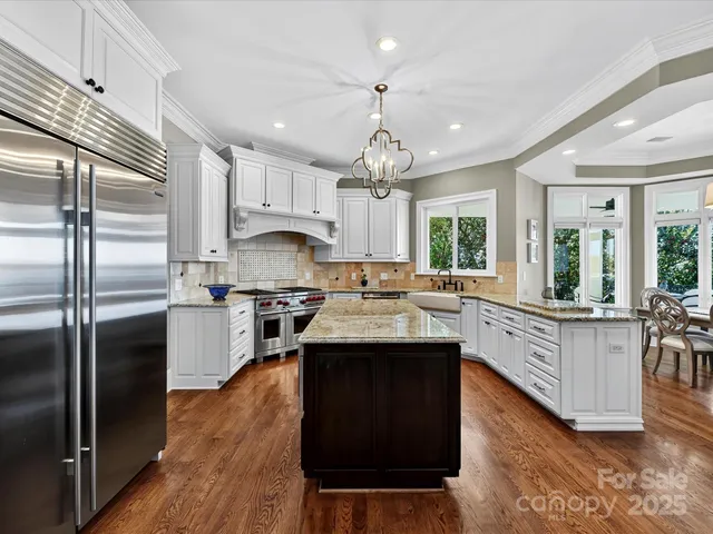 a view of a chairs and table in the balcony