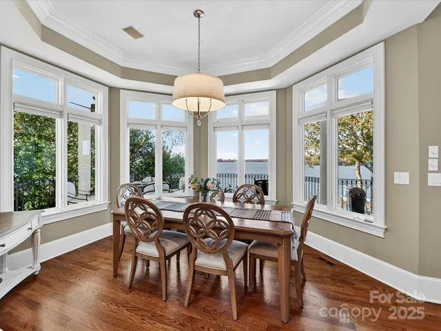 a living room with furniture fireplace and wooden floor