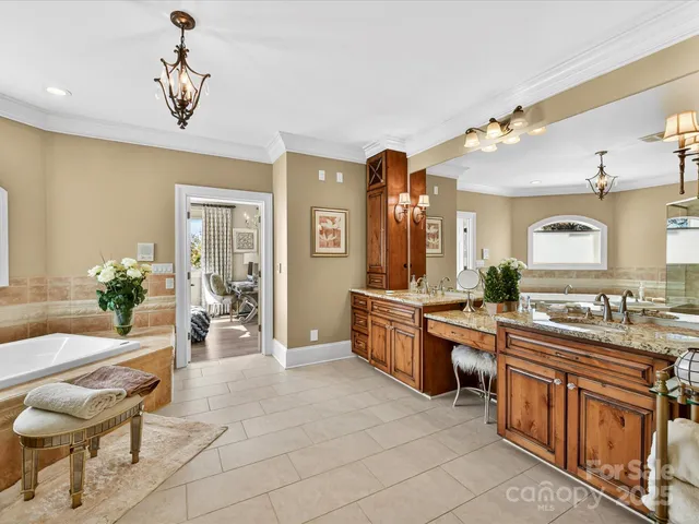 a kitchen with granite countertop a stove sink and refrigerator