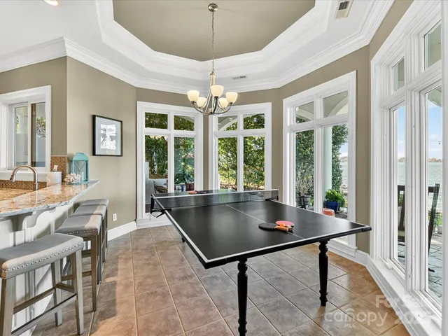 a view of a balcony with two chairs and a table