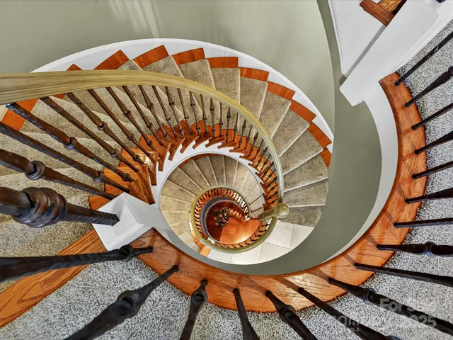 a kitchen with stainless steel appliances kitchen island granite countertop a sink and cabinets