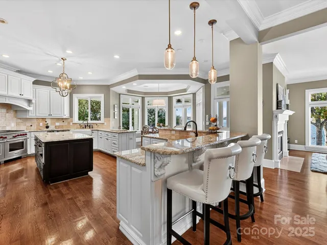 a view of a dining room with furniture wooden floor and chandelier