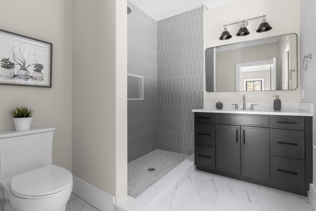 248 Cutler Road Hamilton, MA 01982 - Photo 18 of 31 a bathroom with a toilet sink and mirror