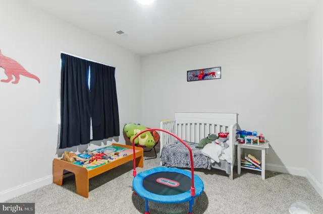 a room with toys and a small refrigerator