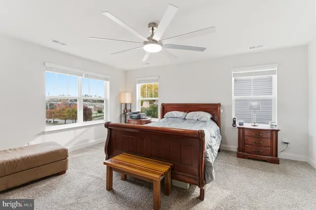 a bedroom with a bed and a couch