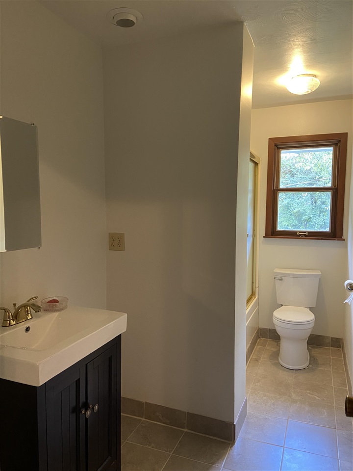 3309 Spring Creek Road Rockford, IL 61107 - Photo 12 of 17 a bathroom with a sink and a toilet
