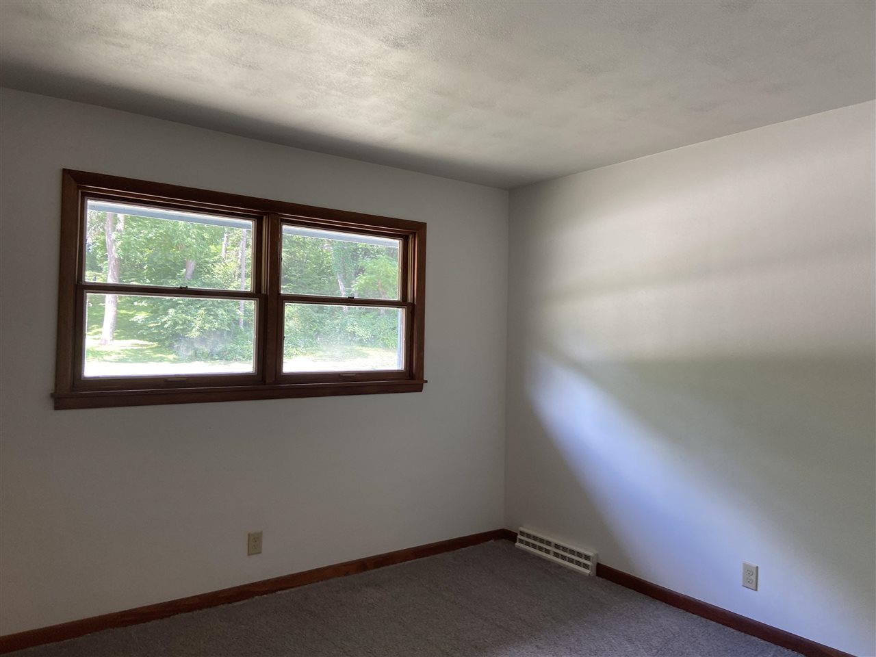 3309 Spring Creek Road Rockford, IL 61107 - Photo 14 of 17 an empty room with a window