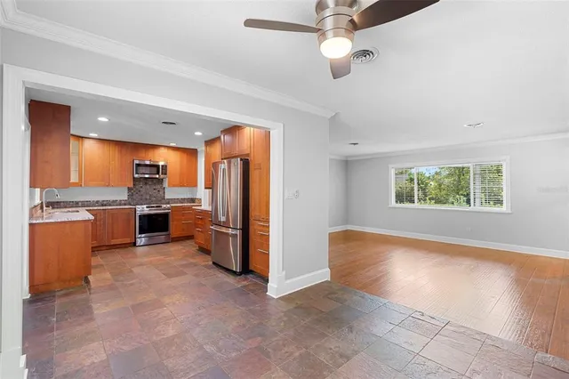 a view of a kitchen with a sink and microwave