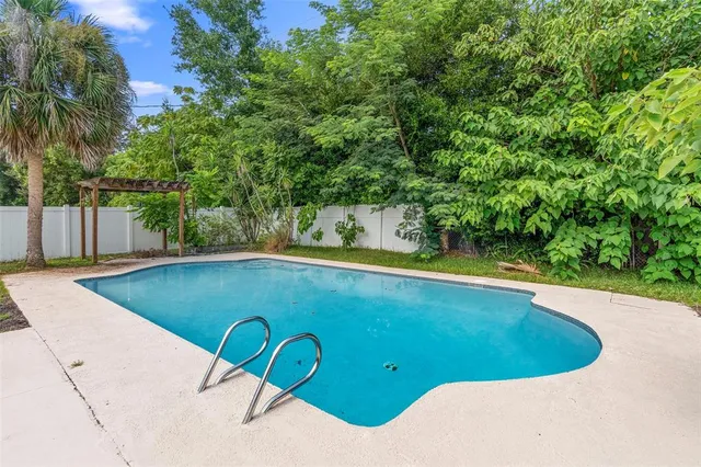a view of a swimming pool with a patio