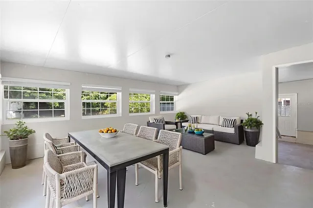 a living room with furniture and windows