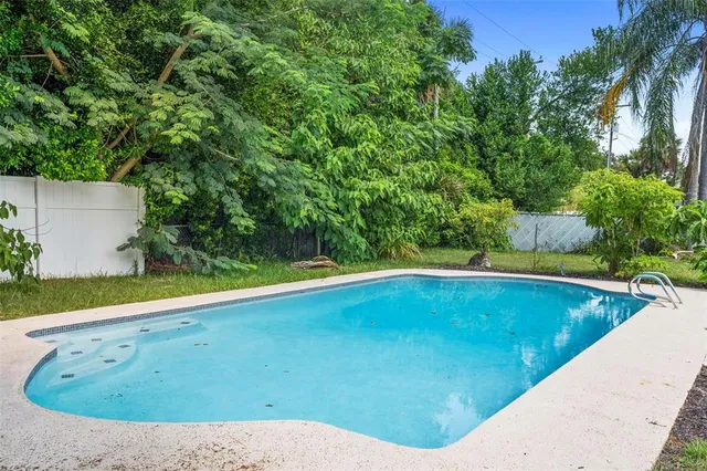 a view of a swimming pool from a balcony