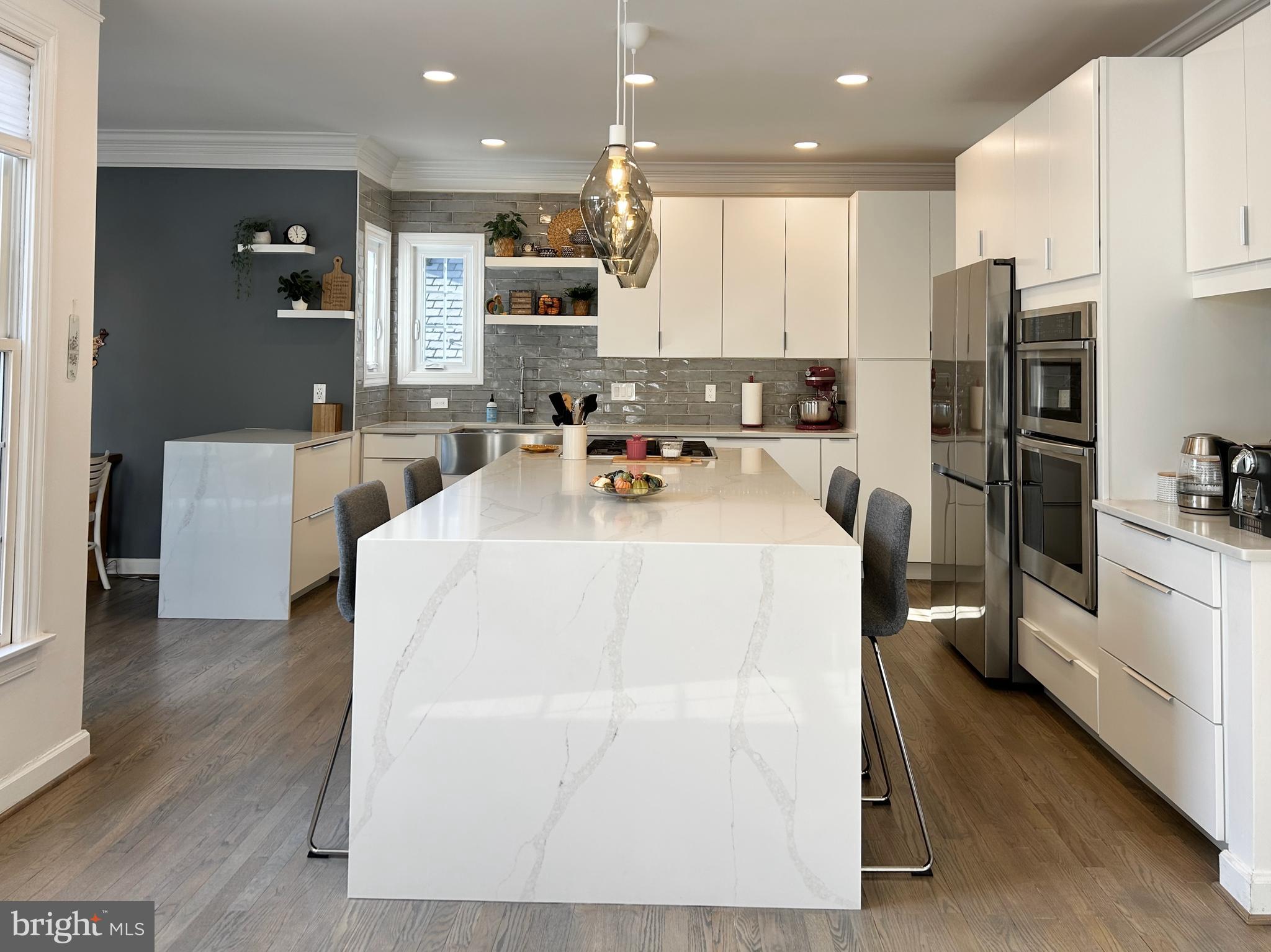 515 Chestertown Street Gaithersburg, MD 20878 - Photo 21 of 50 a kitchen with stainless steel appliances a refrigerator sink and cabinets