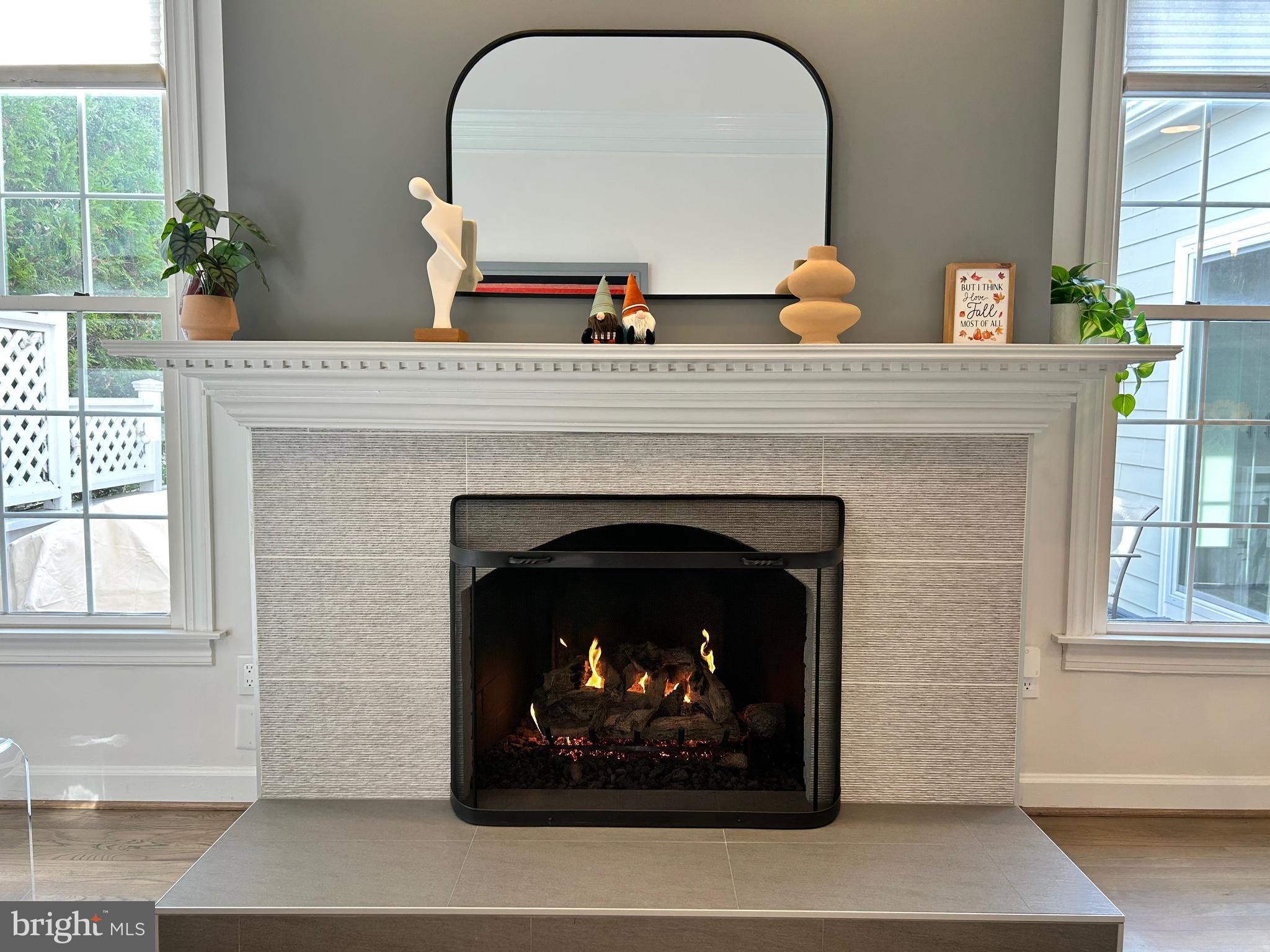 515 Chestertown Street Gaithersburg, MD 20878 - Photo 27 of 50 a fireplace with a clock on top of it