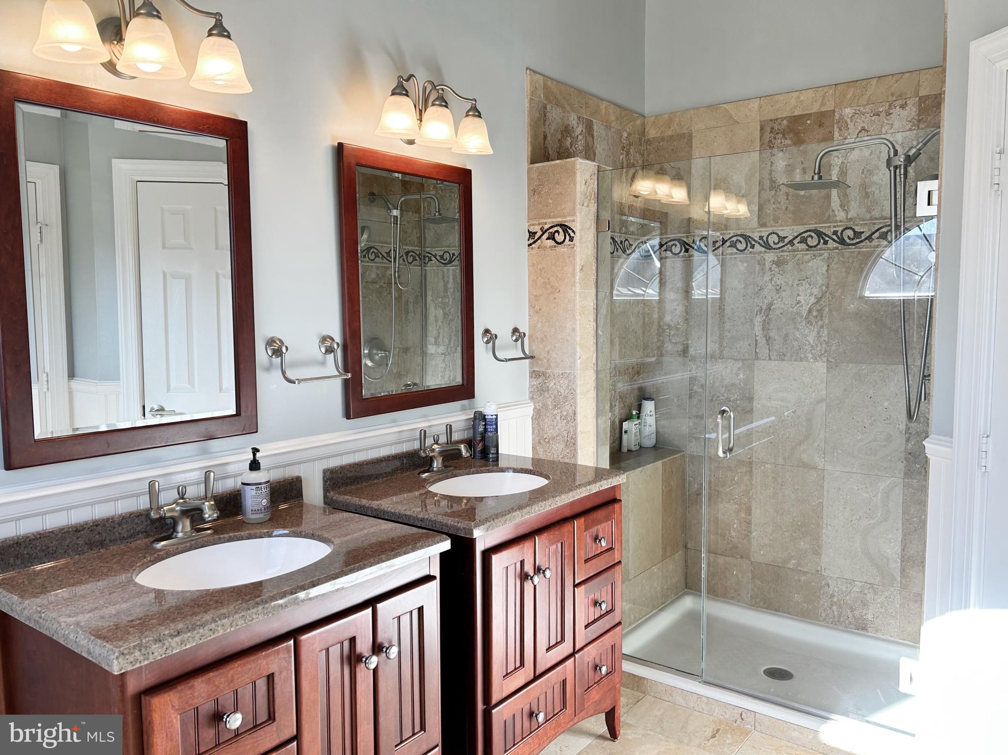 515 Chestertown Street Gaithersburg, MD 20878 - Photo 32 of 50 a bathroom with a sink double vanity and a shower