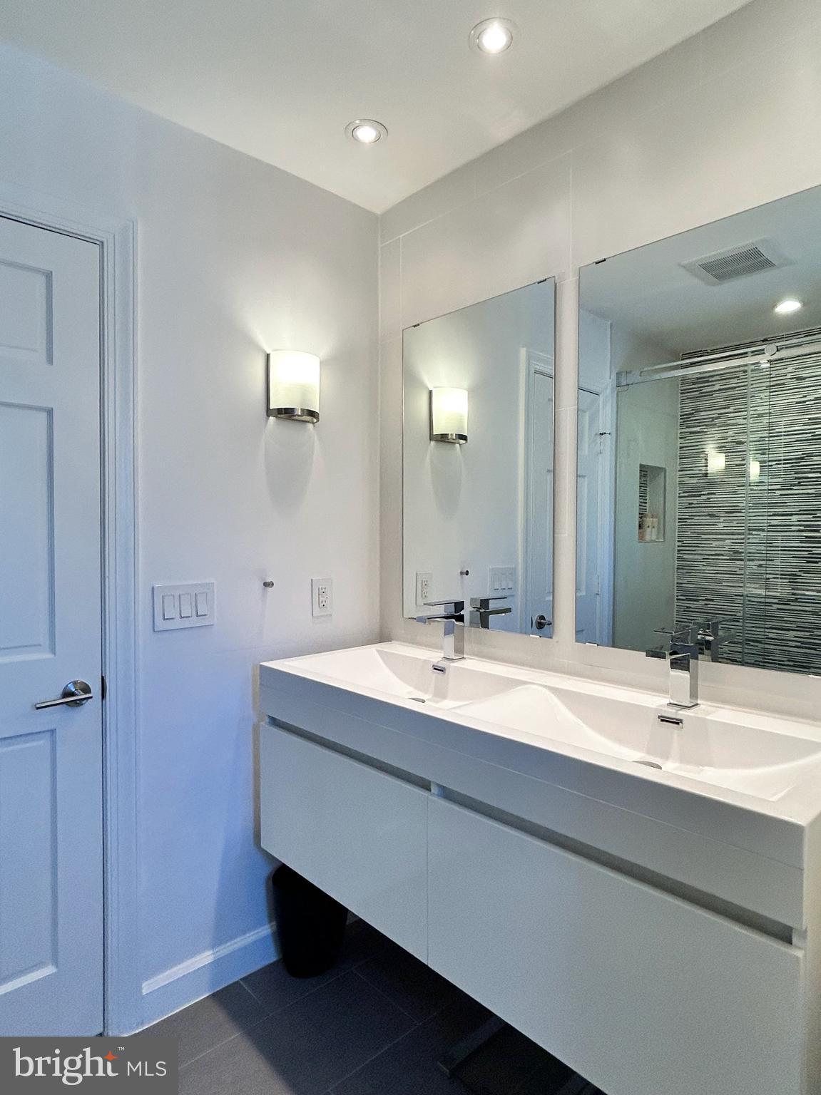 515 Chestertown Street Gaithersburg, MD 20878 - Photo 40 of 50 a bathroom with a double vanity sink a and mirror