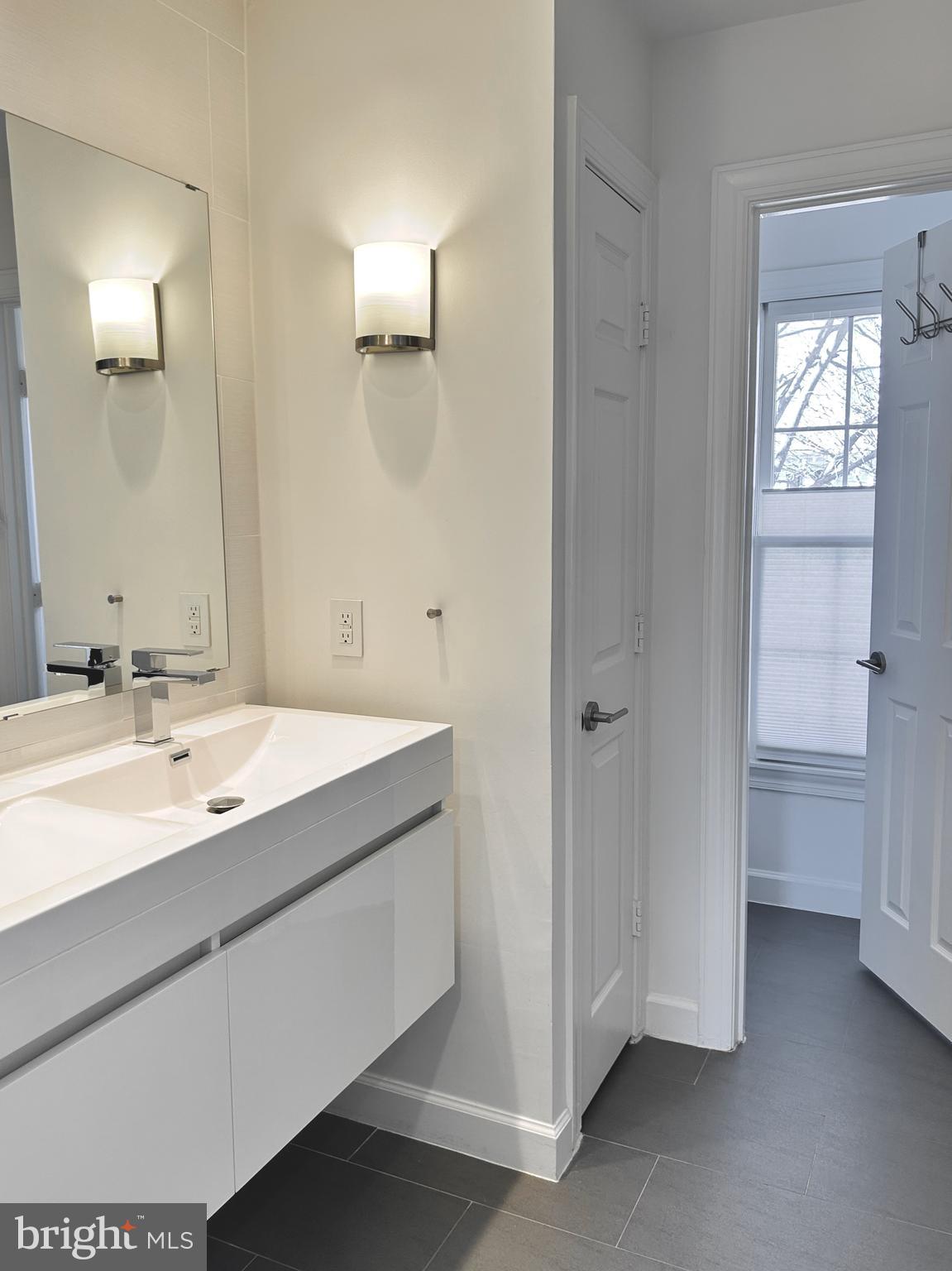 515 Chestertown Street Gaithersburg, MD 20878 - Photo 41 of 50 a bathroom with a double vanity sink and a mirror