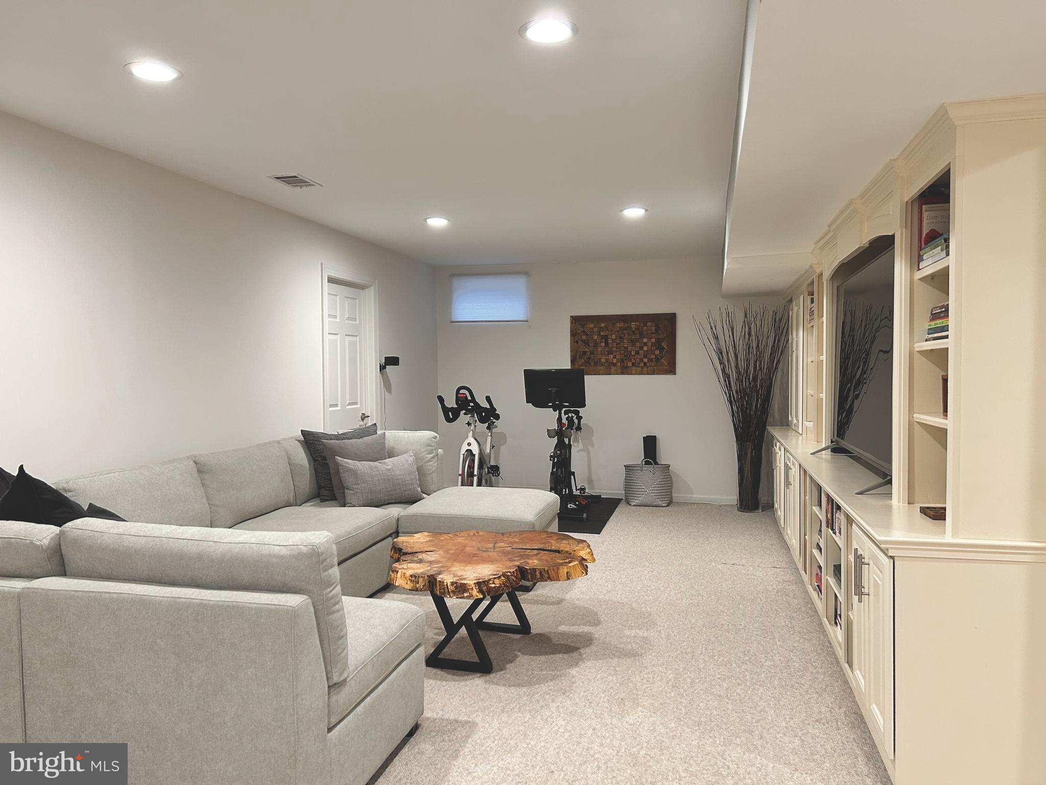 515 Chestertown Street Gaithersburg, MD 20878 - Photo 44 of 50 a living room with furniture and a flat screen tv