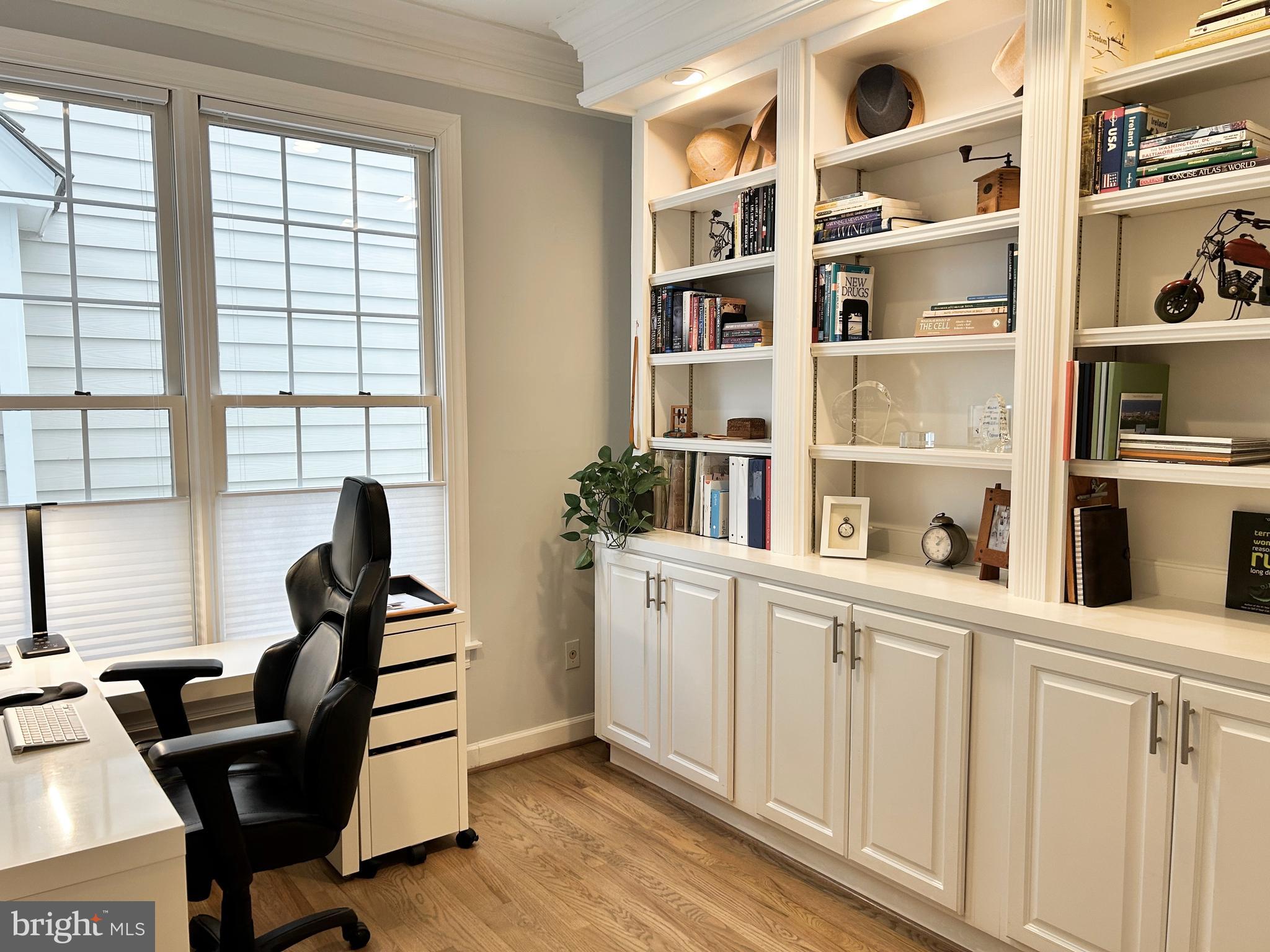 515 Chestertown Street Gaithersburg, MD 20878 - Photo 9 of 50 a kitchen with white cabinets and wooden floor