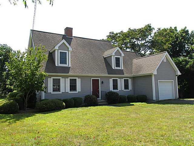 235 Neck Road Madison, CT 06443 - Photo 1 of 1 a front view of a house with yard and green space