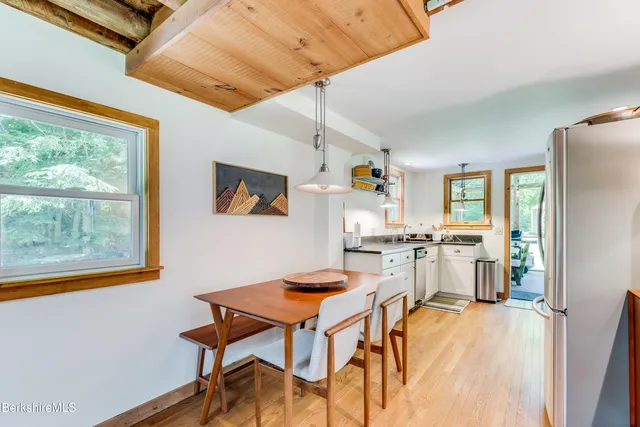 a kitchen with stainless steel appliances granite countertop a stove and cabinets