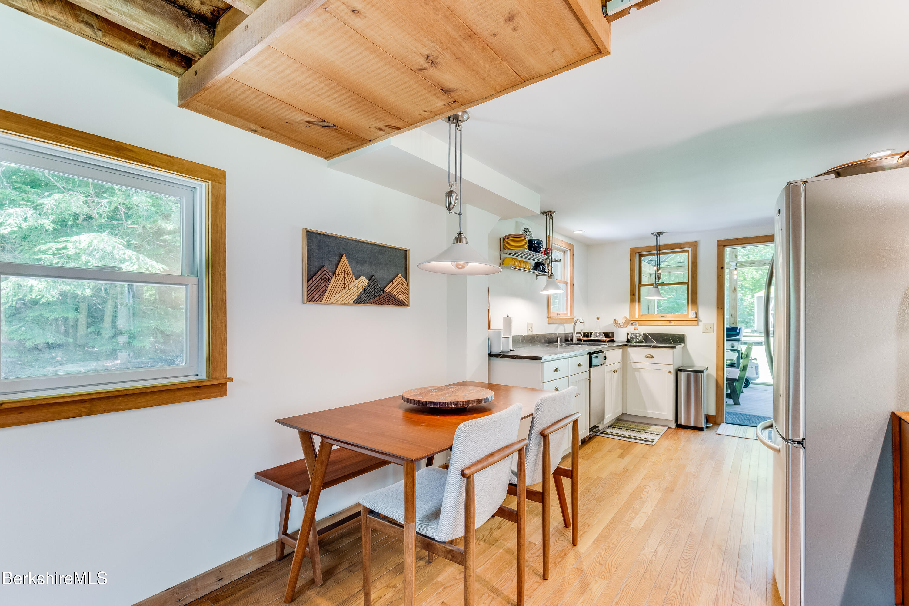 14 Norwalk Acres Road Monterey, MA 01245 - Photo 15 of 56 a view of a dining room with furniture and a window