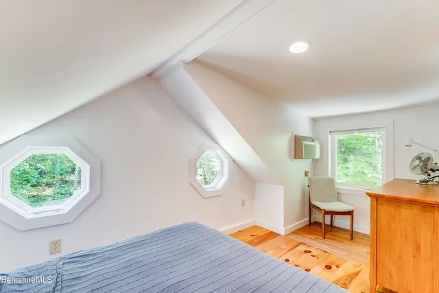 a view of a livingroom with furniture and windows