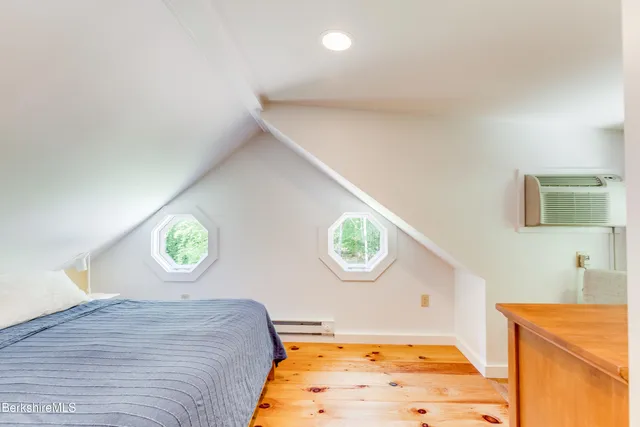 a bedroom with a bed and a view of bathroom